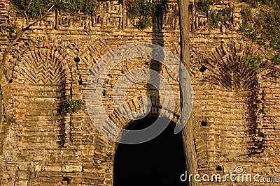 Fragment of an ancient Byzantine wall and an arch in the wall Stock Photo